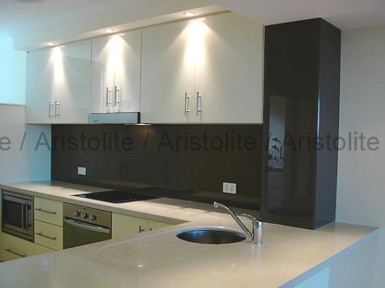 L Shaped Kitchen Design by Aristolite with modern finishes