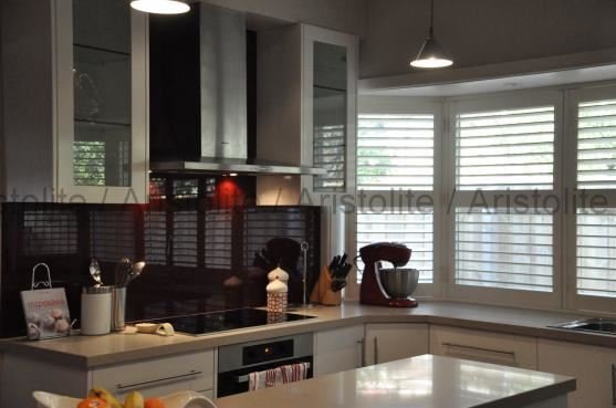 L Shaped Kitchen Design by Aristolite with modern finishes