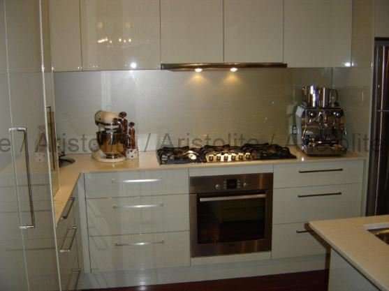 L Shaped Kitchen Design by Aristolite with modern finishes