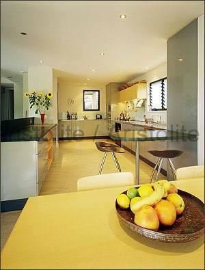 L Shaped Kitchen Design by Aristolite with modern finishes