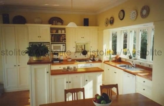 L Shaped Kitchen Design by Aristolite with modern finishes