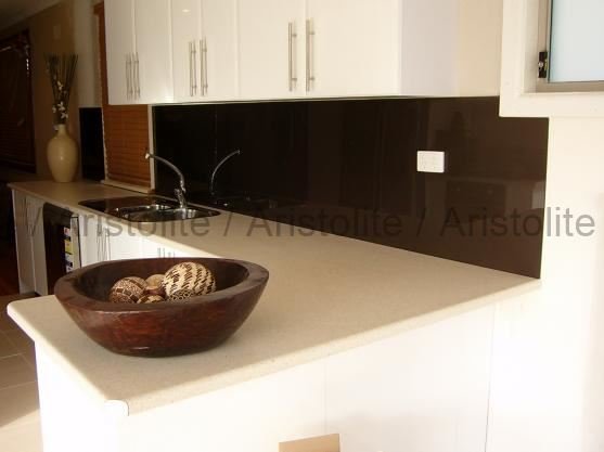 L Shaped Kitchen Design by Aristolite with modern finishes