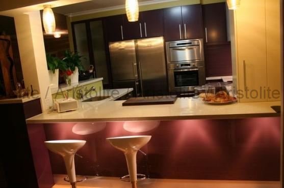 L Shaped Kitchen Design by Aristolite with modern finishes