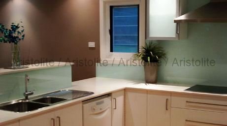 L Shaped Kitchen Design by Aristolite with modern finishes