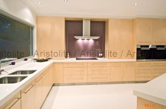 L Shaped Kitchen Design by Aristolite with modern finishes