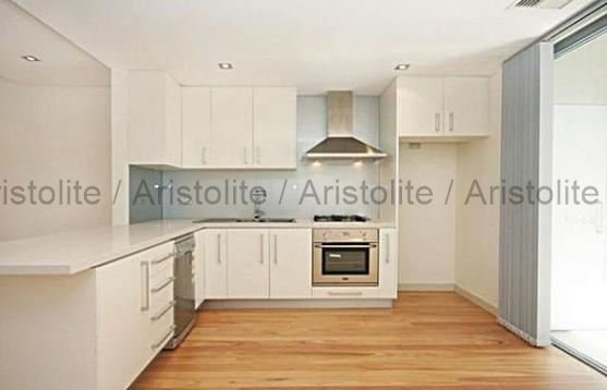 L Shaped Kitchen Design by Aristolite with modern finishes
