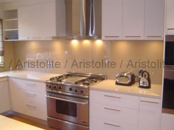 L Shaped Kitchen Design by Aristolite with modern finishes