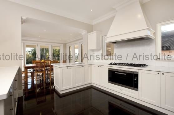 L Shaped Kitchen Design by Aristolite with modern finishes