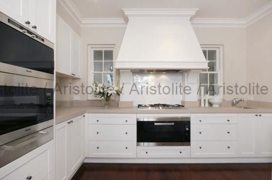 L Shaped Kitchen Design by Aristolite with modern finishes