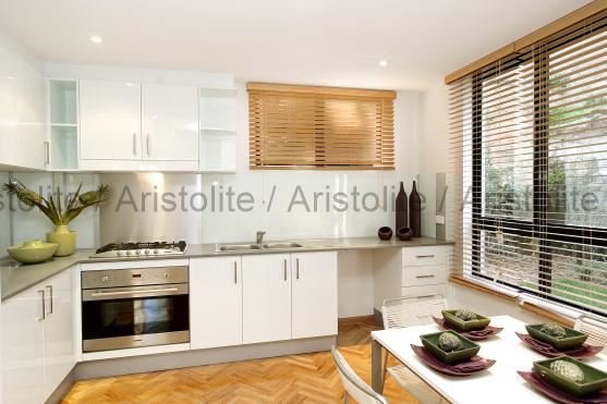 L Shaped Kitchen Design by Aristolite with modern finishes